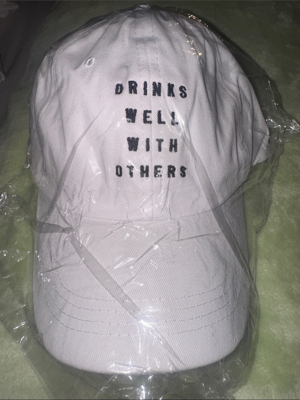 SHEIN NWOT White Baseball Cap with Black “Drinks Well With Others” Text